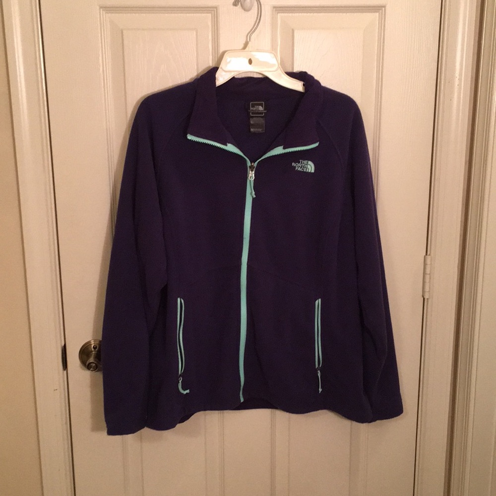 Purple and blue north face jacket